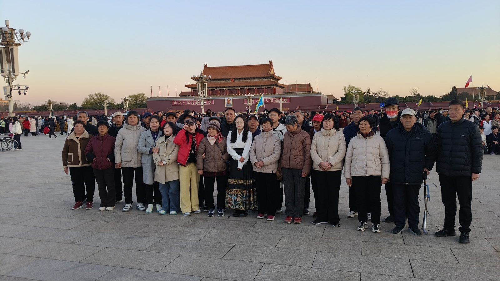 Group photograph of travellers in Tiananmen Square, Beijing