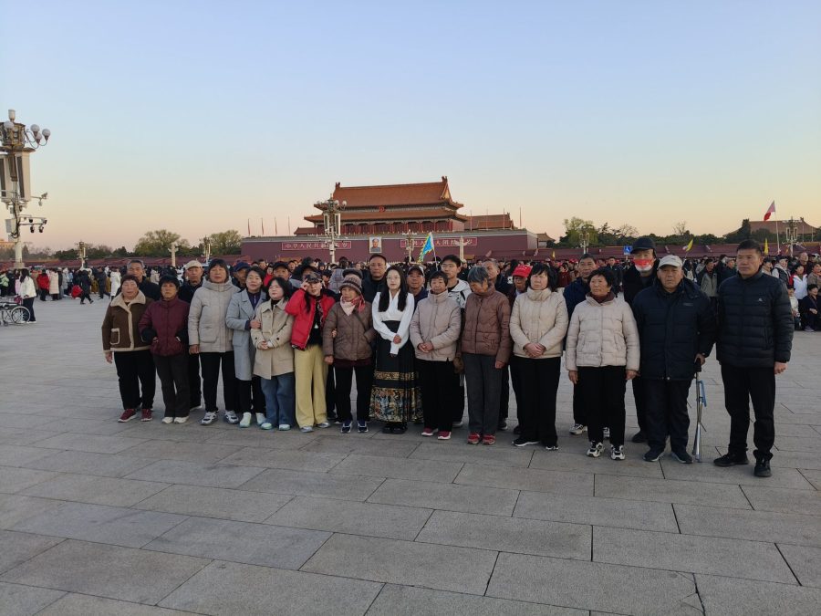 Group photograph of travellers in Tiananmen Square, Beijing