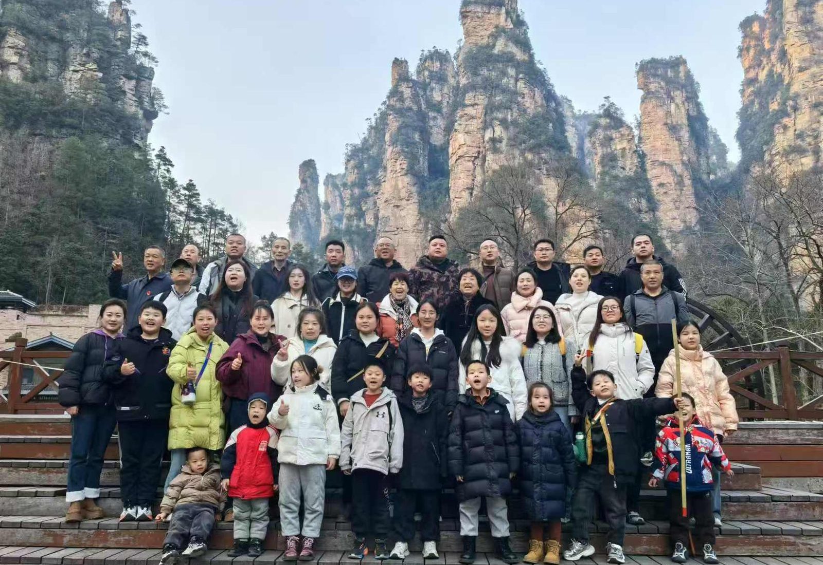 Group of travellers on the steps below the sandstone pillars of Zhangjiajie