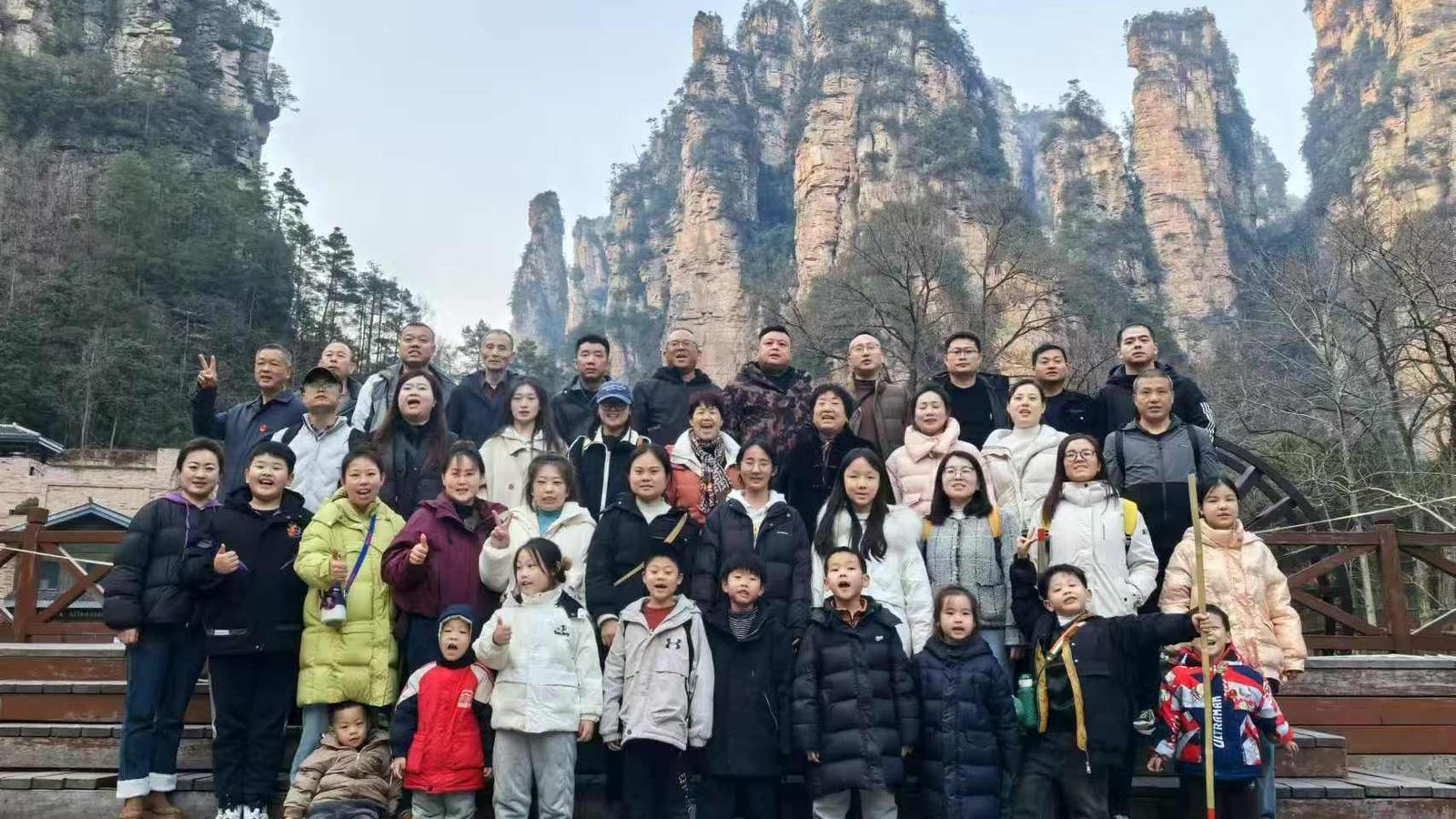 Group of travellers on the steps below the sandstone pillars of Zhangjiajie