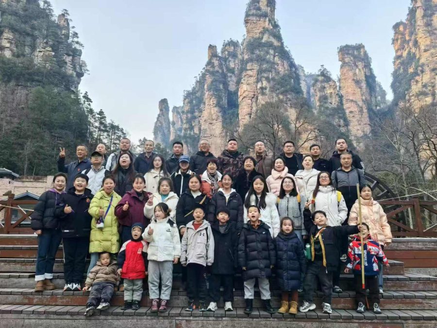 Group of travellers on the steps below the sandstone pillars of Zhangjiajie